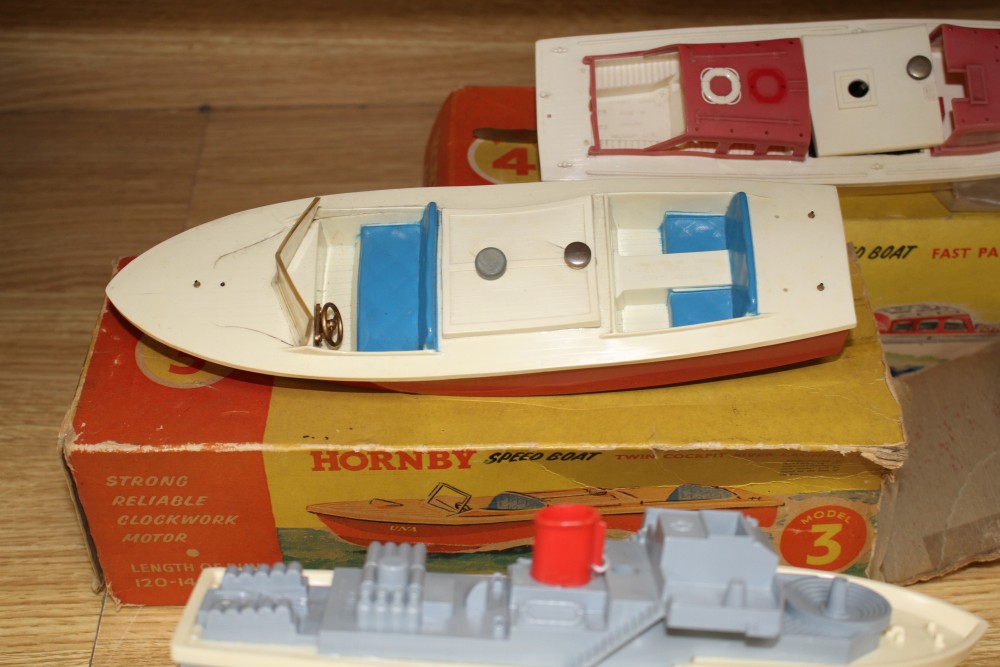 A boxed Sutcliffe model tinplate clockwork nautilus submarine, a boxed Scalex Hunter motor gun boat and two Hornby plastic bodied speed